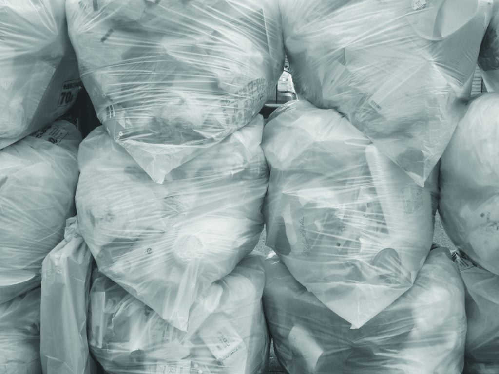 A pile of plastic bags in a warehouse.